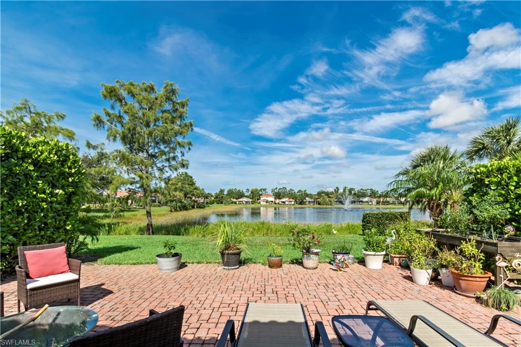 19703 Villa Rosa Loop Estero, FL 33967 - Photo 24 of 29 a view of yard with seating area and trees in the background