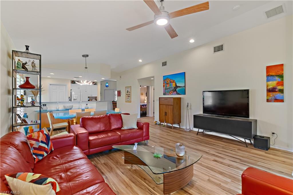 19703 Villa Rosa Loop Estero, FL 33967 - Photo 6 of 29 a living room with furniture and a flat screen tv
