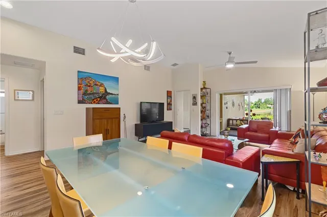 a living room with fireplace furniture and a flat screen tv