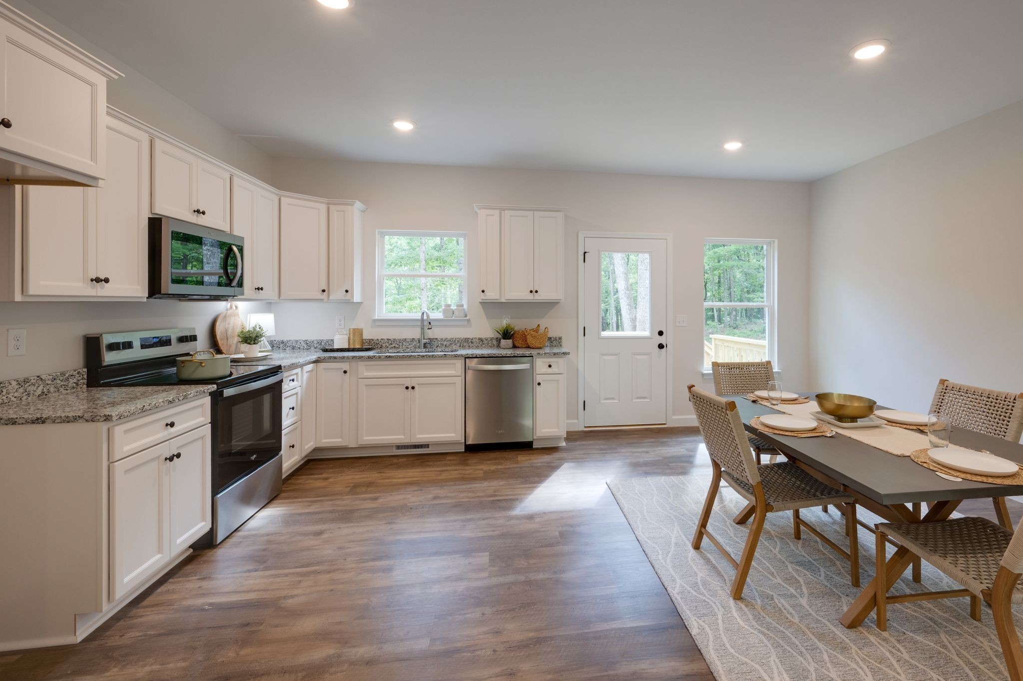 766 Billy Wynn Road Dickson, TN 37055 - Photo 13 of 31 a kitchen with a sink a window a counter top space and cabinets