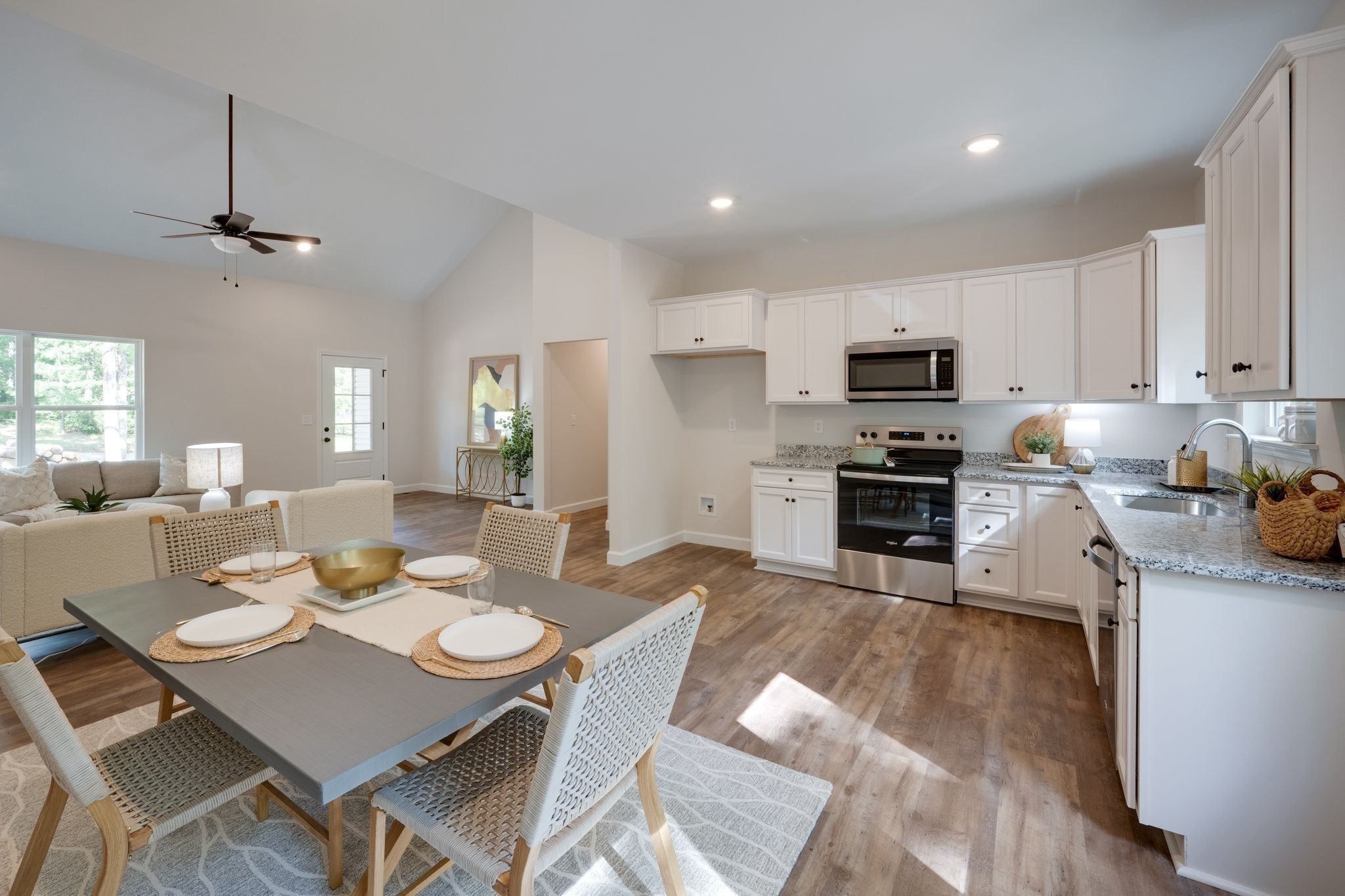 766 Billy Wynn Road Dickson, TN 37055 - Photo 14 of 31 a view of a dining room with furniture a kitchen and chandelier
