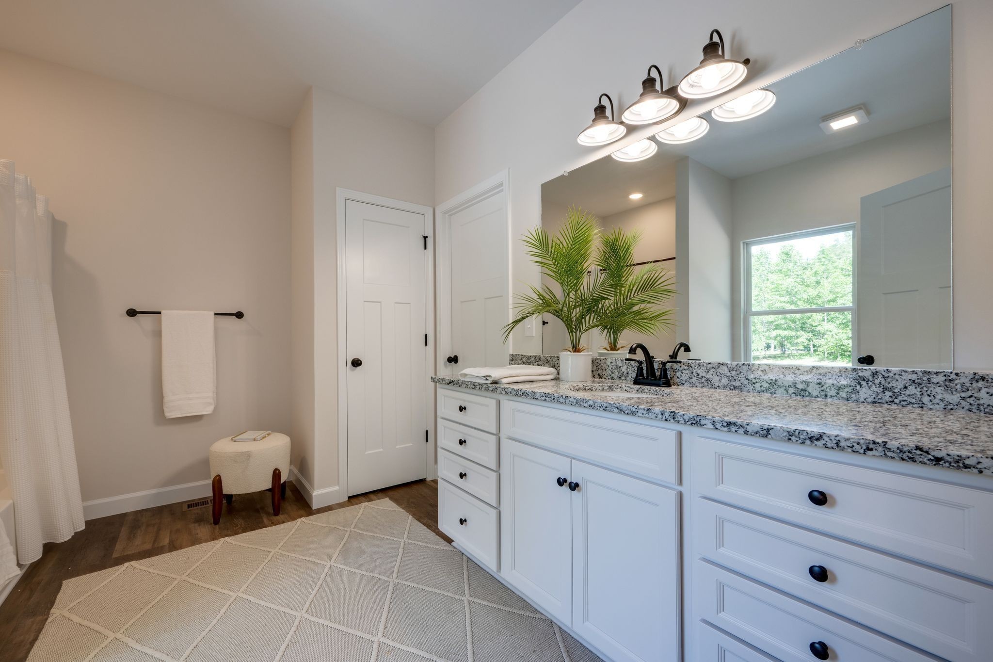 766 Billy Wynn Road Dickson, TN 37055 - Photo 18 of 31 a spacious bathroom with a granite countertop sink a toilet and a mirror