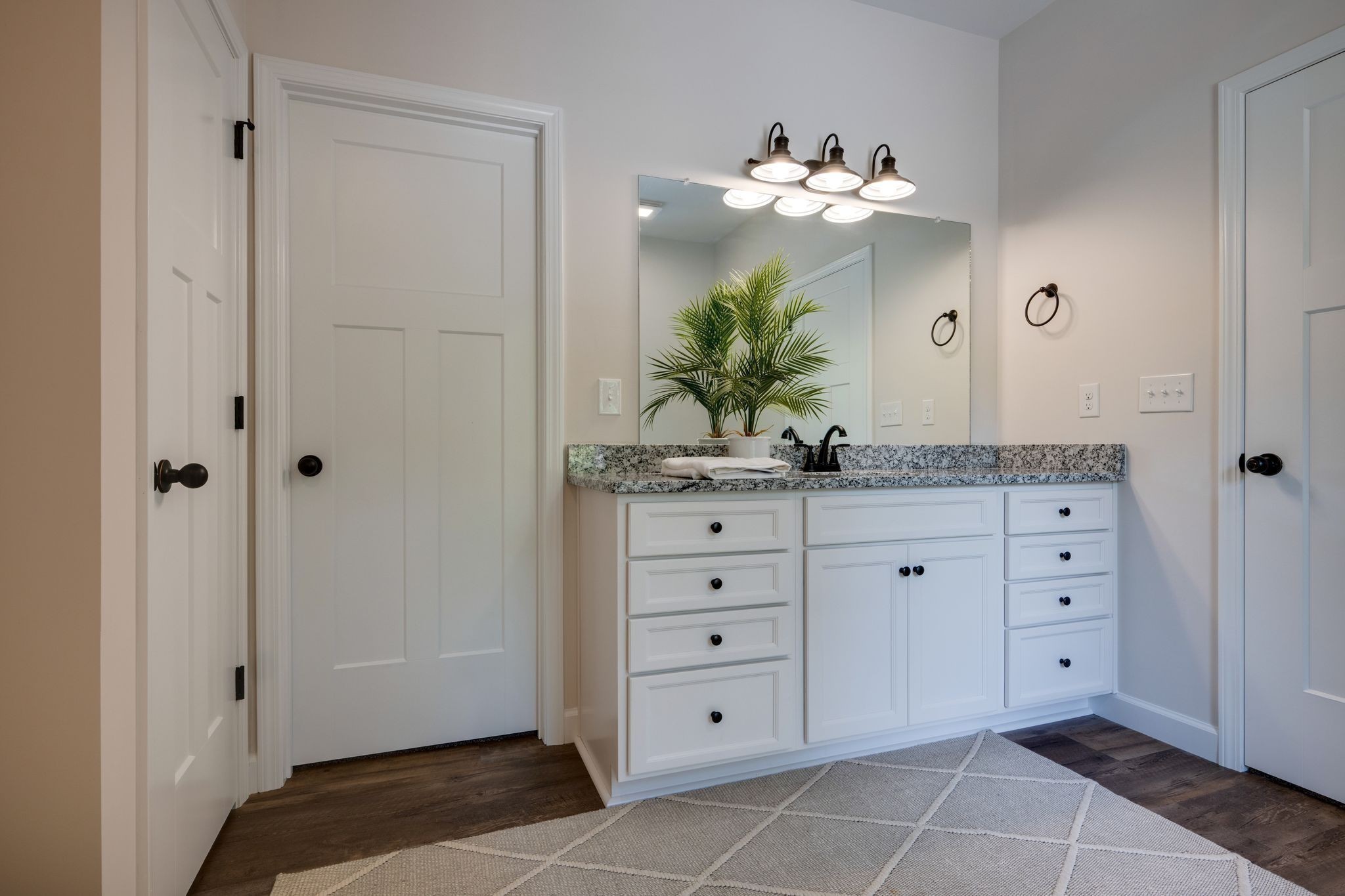 766 Billy Wynn Road Dickson, TN 37055 - Photo 19 of 31 a spacious bathroom with a granite countertop sink a mirror and a potted plant