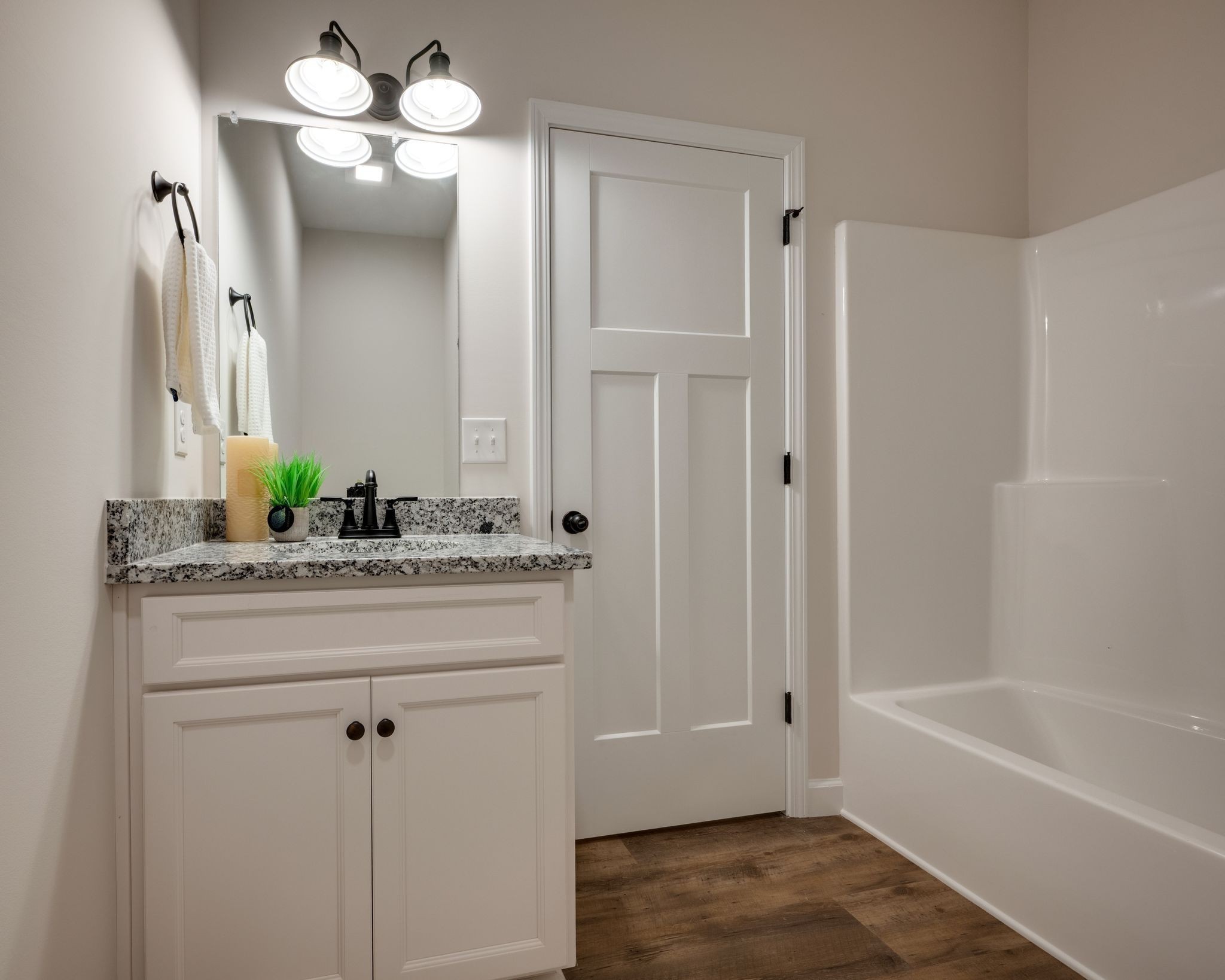 766 Billy Wynn Road Dickson, TN 37055 - Photo 23 of 31 a bathroom with a granite countertop sink a mirror and a bathtub