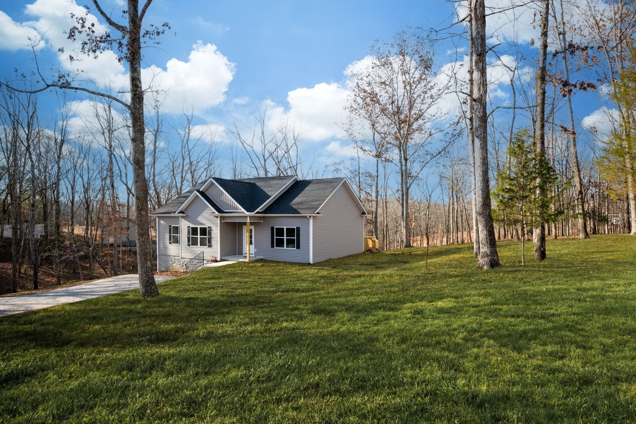 766 Billy Wynn Road Dickson, TN 37055 - Photo 3 of 31 a front view of a house with a yard