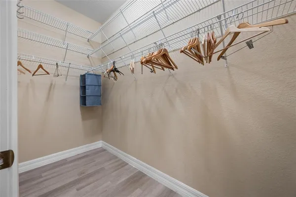 a spacious bathroom with a tub shower and sink