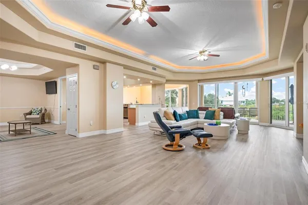 a kitchen with stainless steel appliances granite countertop a sink and a refrigerator
