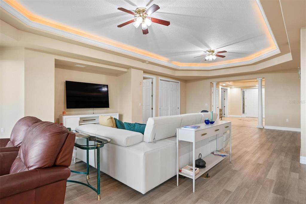 6100 Jessie Harbor Drive, Unit 202 Osprey, FL 34229 - Photo 38 of 83 a living room with furniture and a flat screen tv