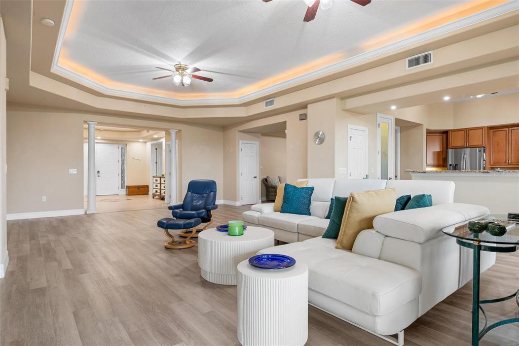 6100 Jessie Harbor Drive, Unit 202 Osprey, FL 34229 - Photo 41 of 83 a living room with furniture and a chandelier