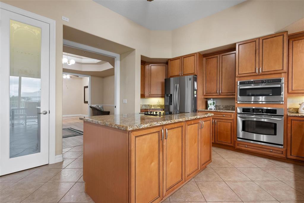 6100 Jessie Harbor Drive, Unit 202 Osprey, FL 34229 - Photo 48 of 83 a kitchen with stainless steel appliances granite countertop a refrigerator oven a sink and dishwasher