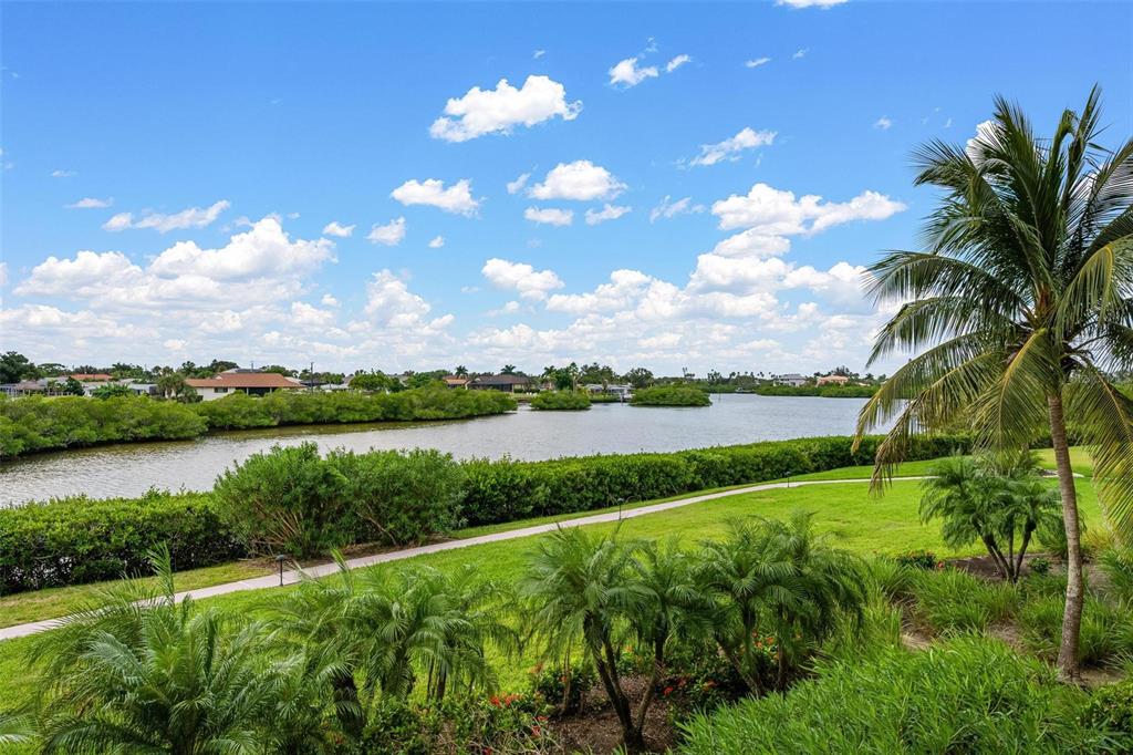 6100 Jessie Harbor Drive, Unit 202 Osprey, FL 34229 - Photo 56 of 83 a view of a lake with a big yard