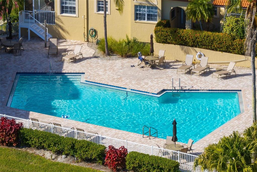 6100 Jessie Harbor Drive, Unit 202 Osprey, FL 34229 - Photo 63 of 83 a view of a backyard and floor to ceiling window