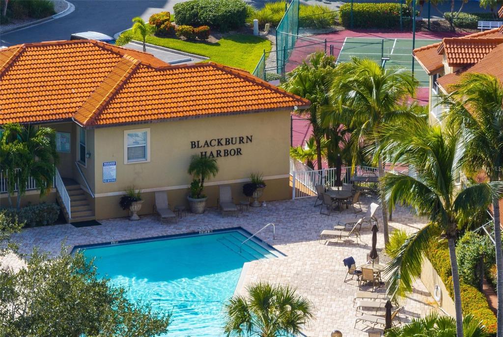 6100 Jessie Harbor Drive, Unit 202 Osprey, FL 34229 - Photo 65 of 83 a front view of a house with garden