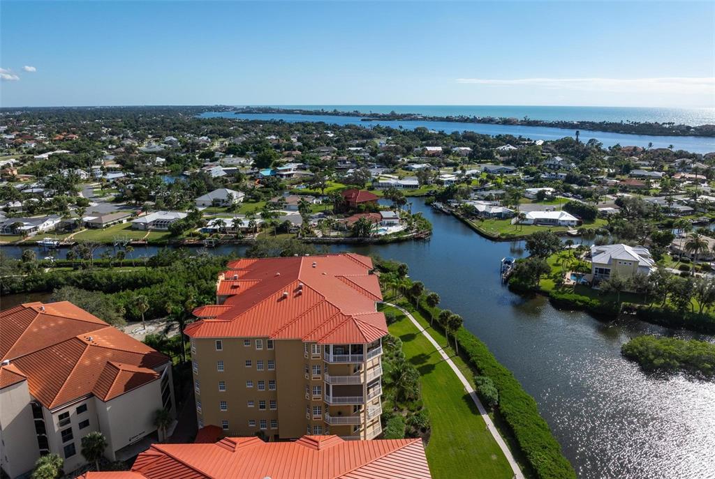 6100 Jessie Harbor Drive, Unit 202 Osprey, FL 34229 - Photo 69 of 83 an aerial view of residential houses with outdoor space and swimming pool