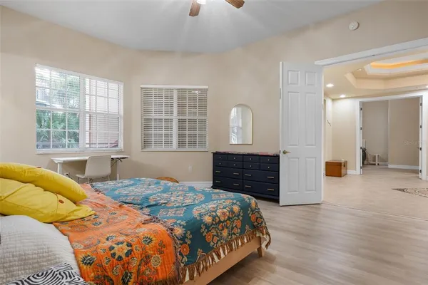 a bedroom with bed and window