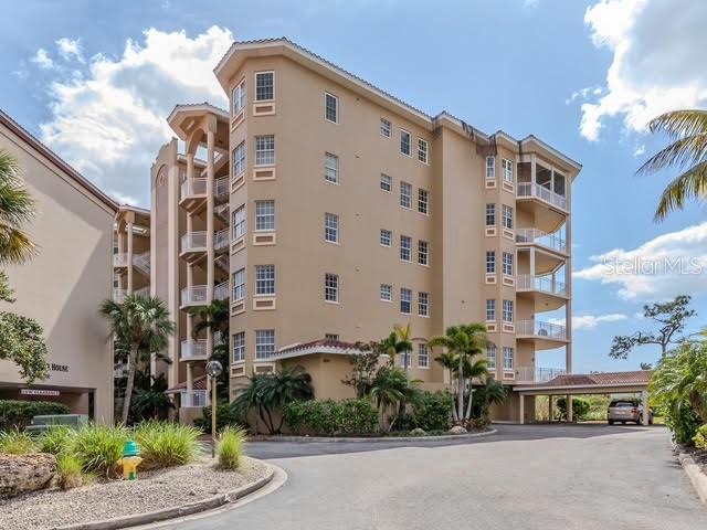 6100 Jessie Harbor Drive, Unit 202 Osprey, FL 34229 - Photo 76 of 83 a front view of a building