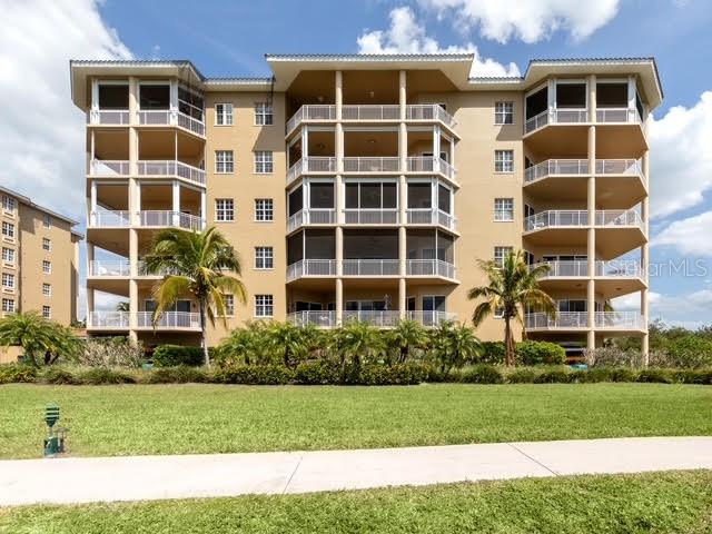 6100 Jessie Harbor Drive, Unit 202 Osprey, FL 34229 - Photo 77 of 83 a front view of a building