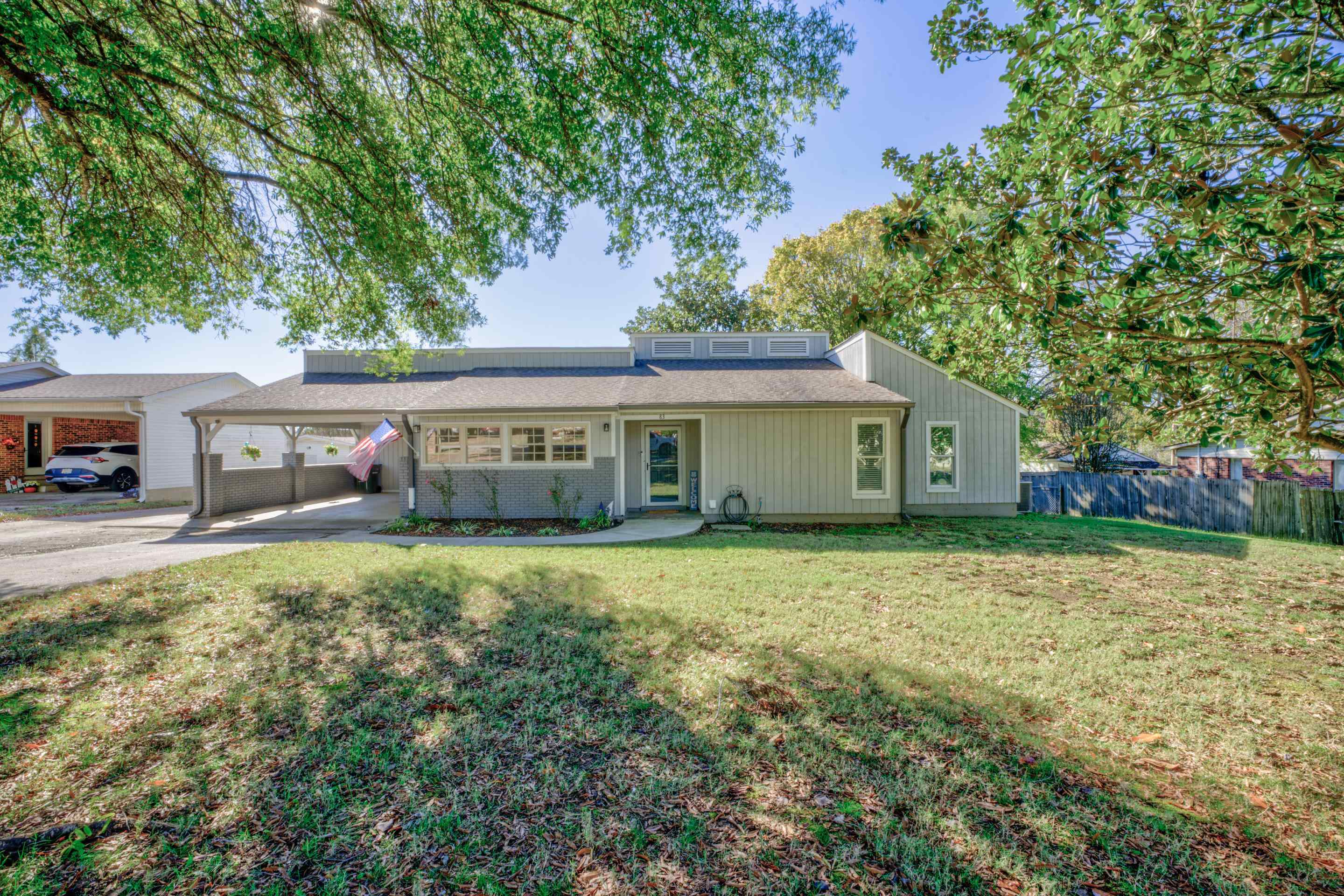 83 Barry White Lane Ripley, TN 38063 - Photo 2 of 37 a front view of house with yard and trees
