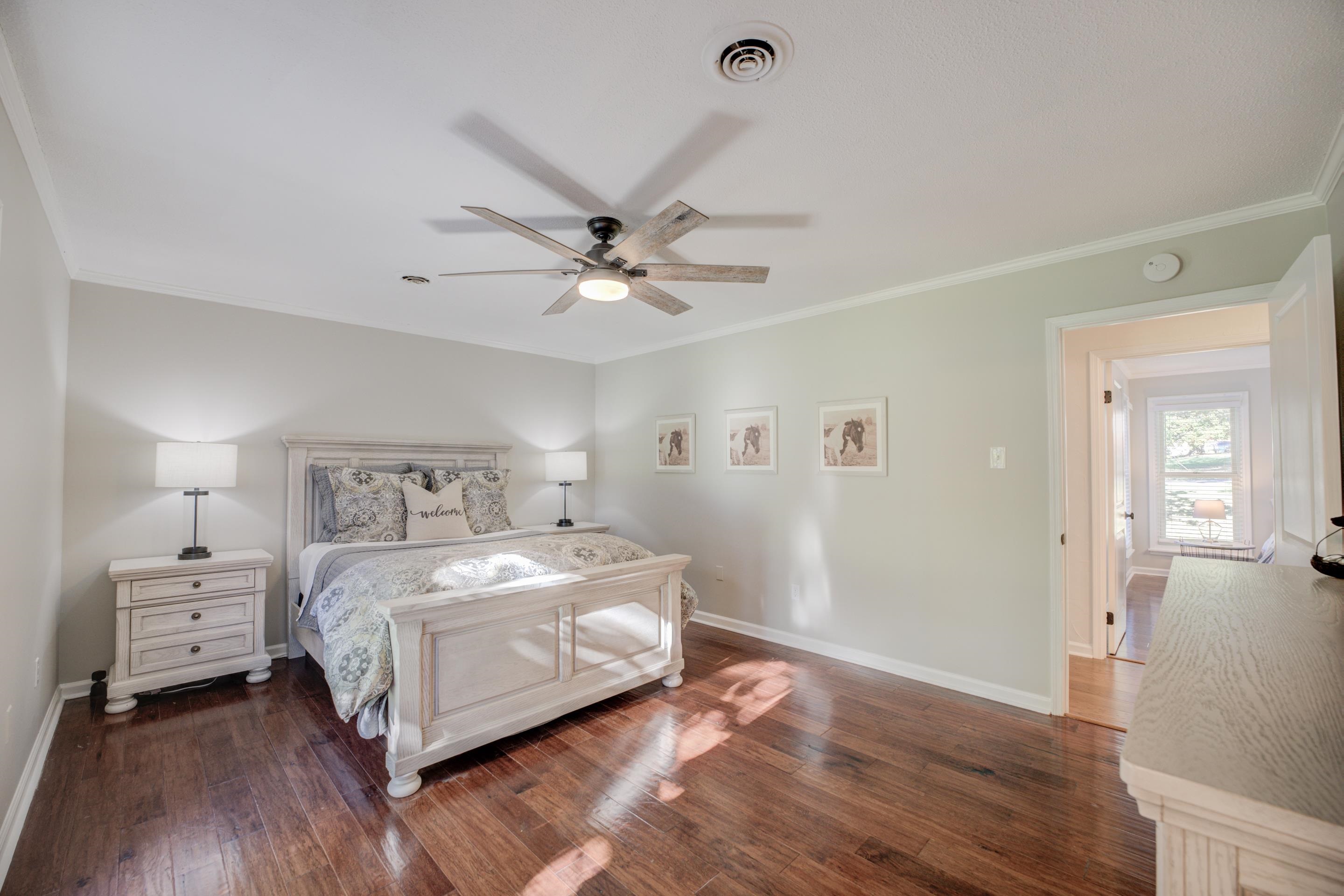 83 Barry White Lane Ripley, TN 38063 - Photo 22 of 37 a bedroom with a bed and a chandelier