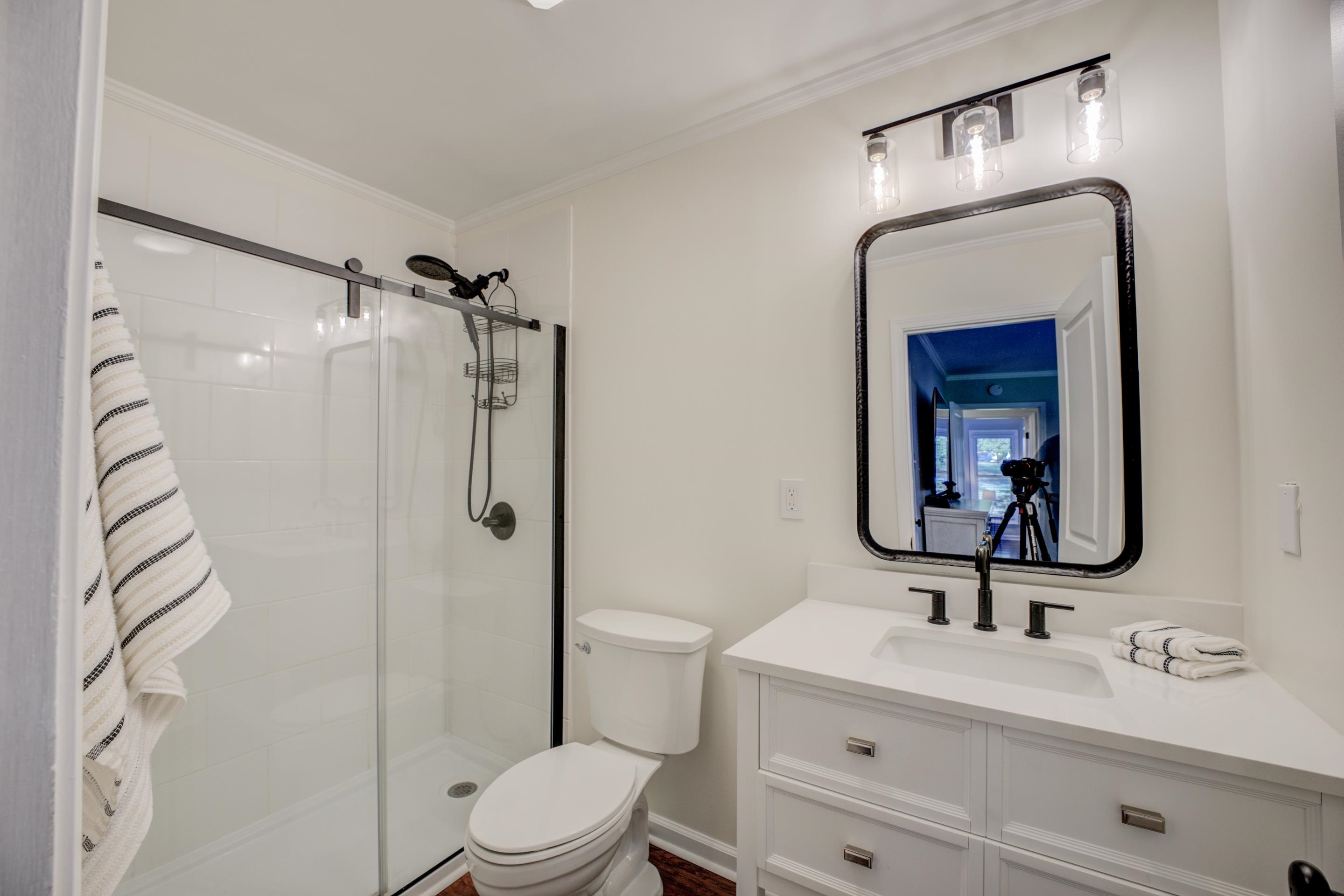 83 Barry White Lane Ripley, TN 38063 - Photo 28 of 37 a bathroom with a toilet sink vanity and mirror