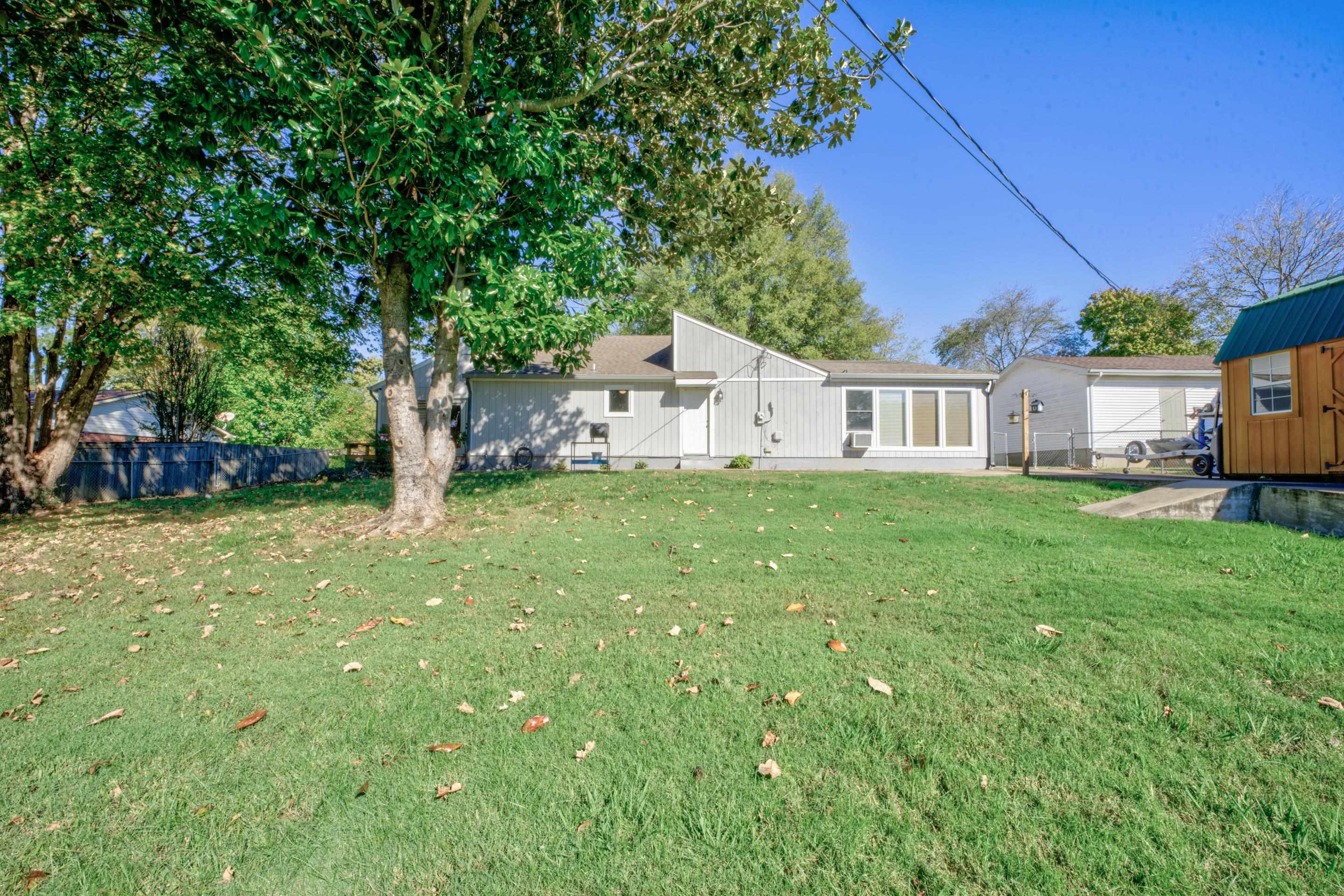 83 Barry White Lane Ripley, TN 38063 - Photo 31 of 37 a view of a house with backyard and a tree