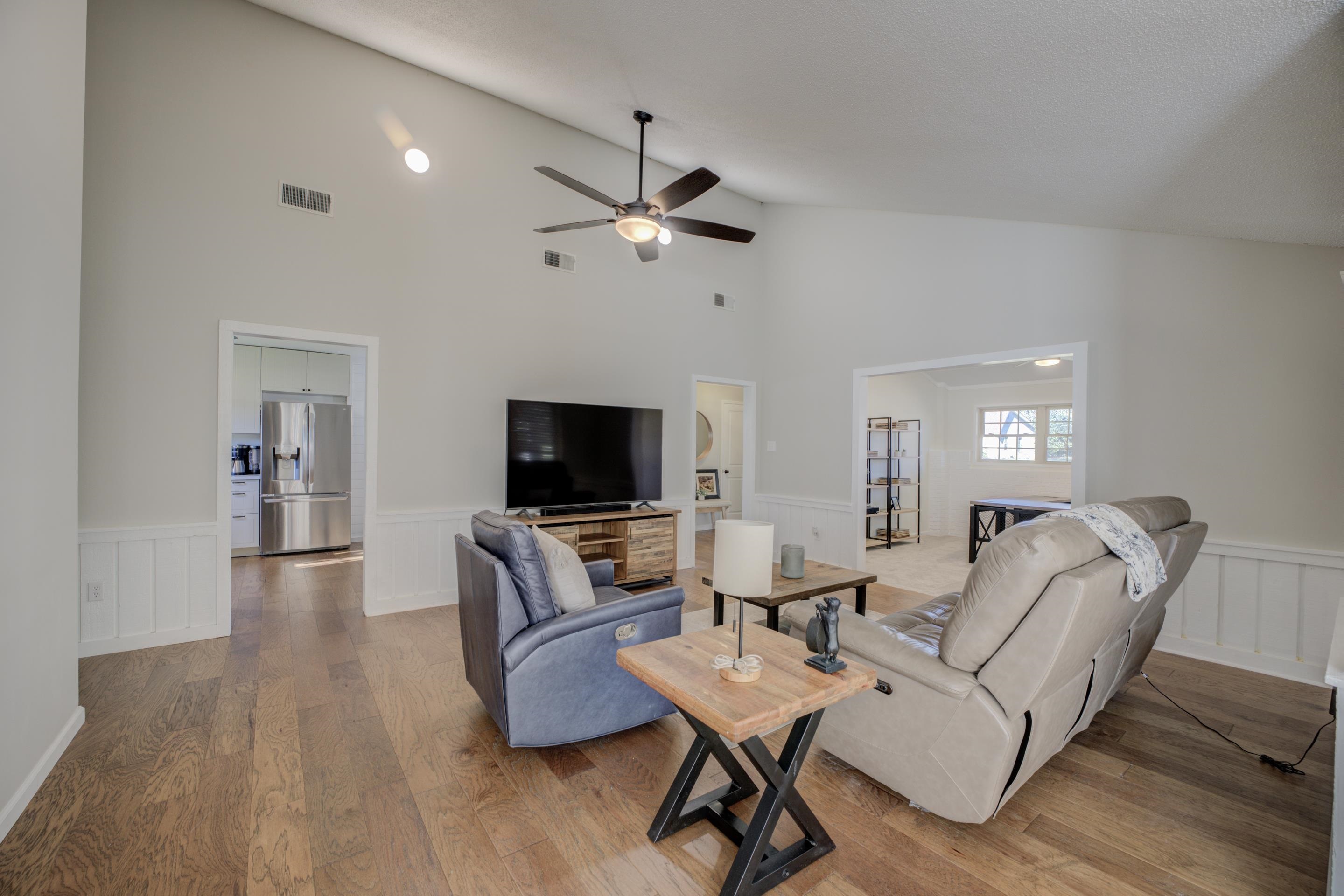 83 Barry White Lane Ripley, TN 38063 - Photo 10 of 37 a living room with furniture a ceiling fan and a flat screen tv