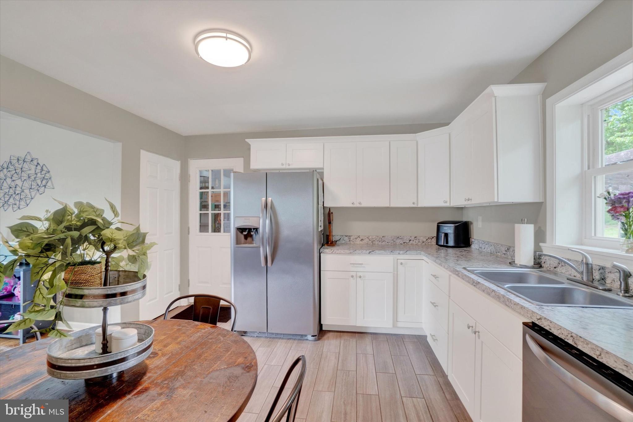 2560 Log Cabin Road York, PA 17408 - Photo 11 of 26 a kitchen with a refrigerator and a sink
