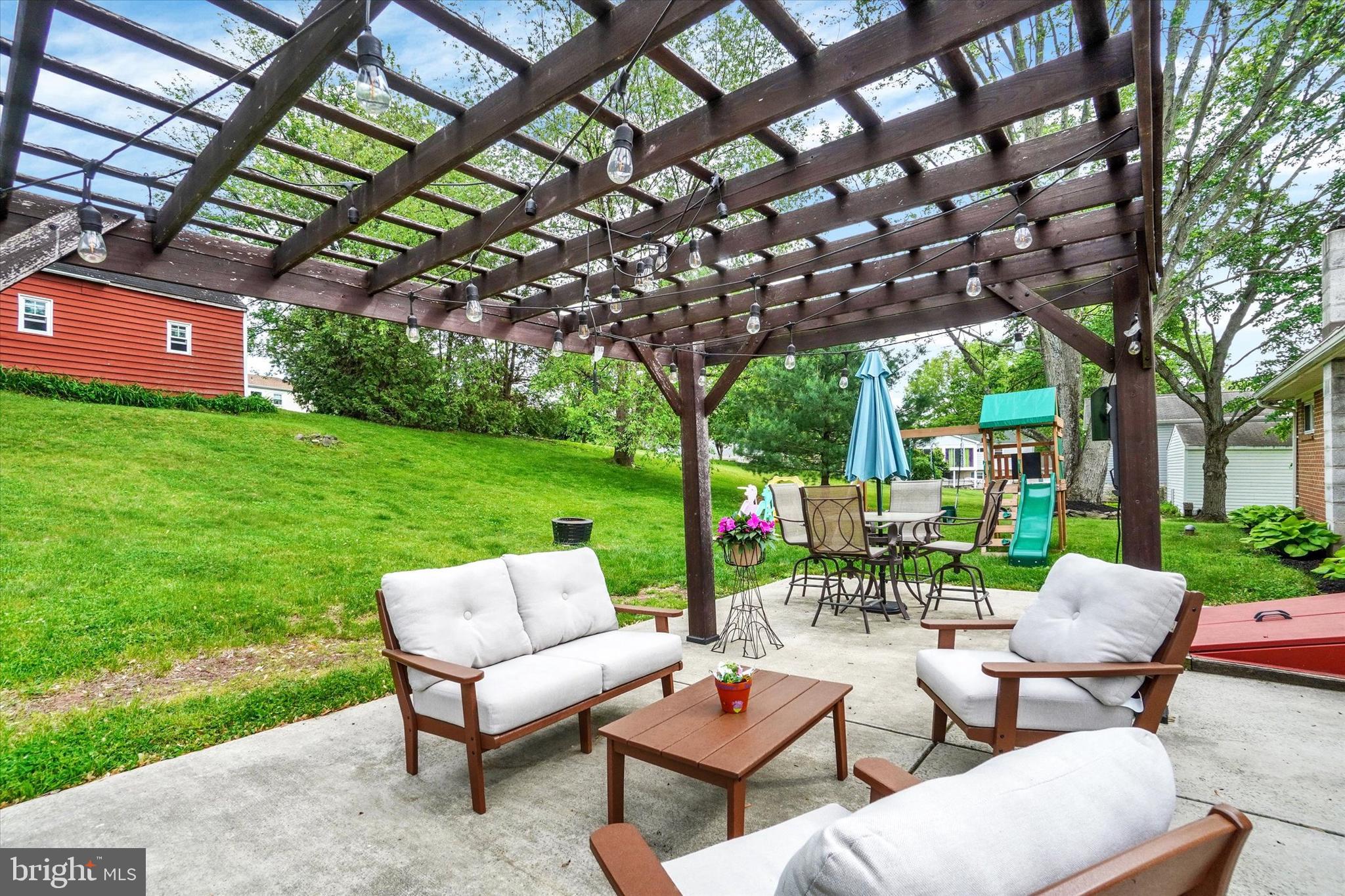 2560 Log Cabin Road York, PA 17408 - Photo 21 of 26 a view of a patio with couches table and chairs with a large tree