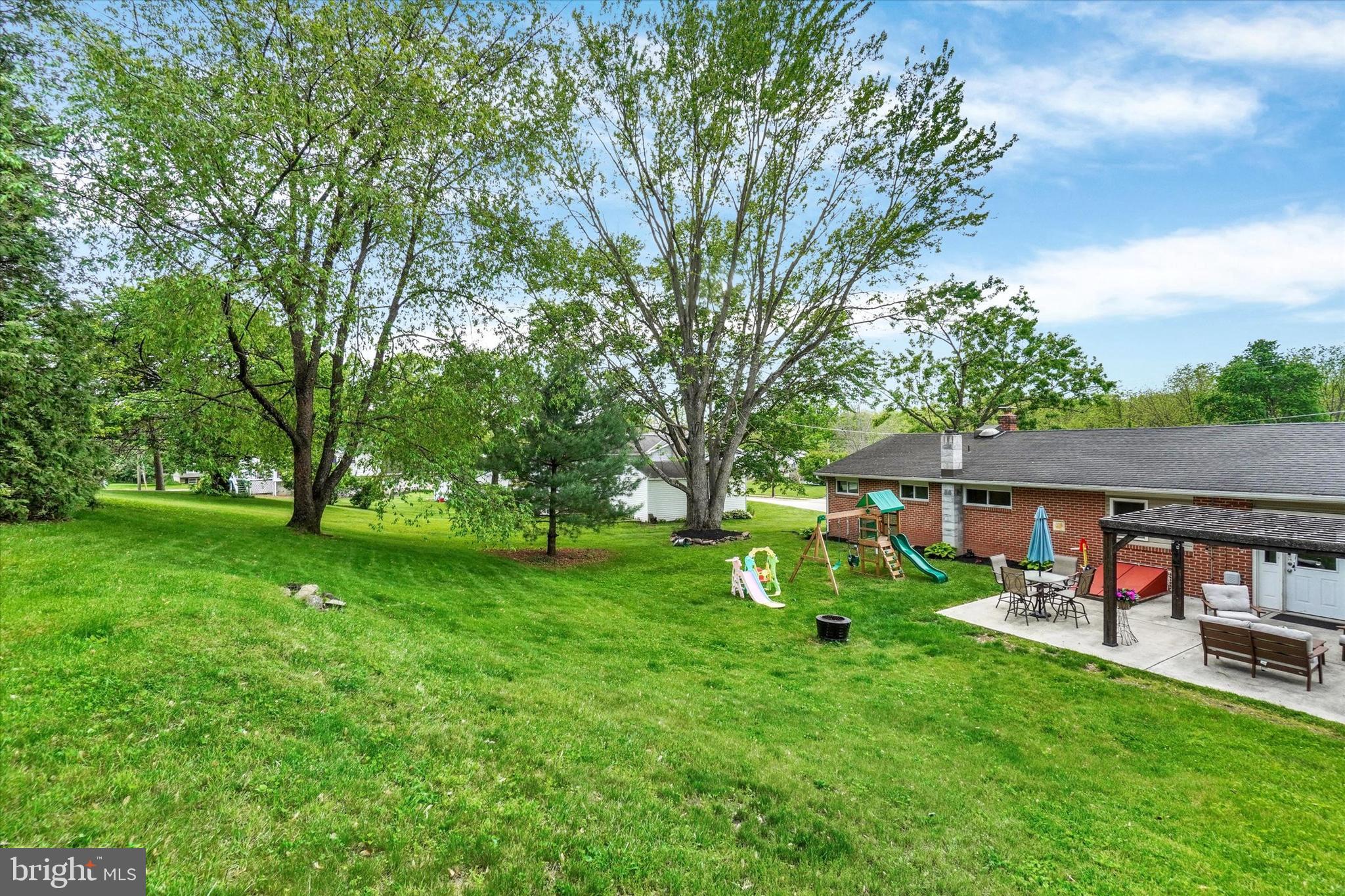 2560 Log Cabin Road York, PA 17408 - Photo 26 of 26 a view of backyard with a table and chairs