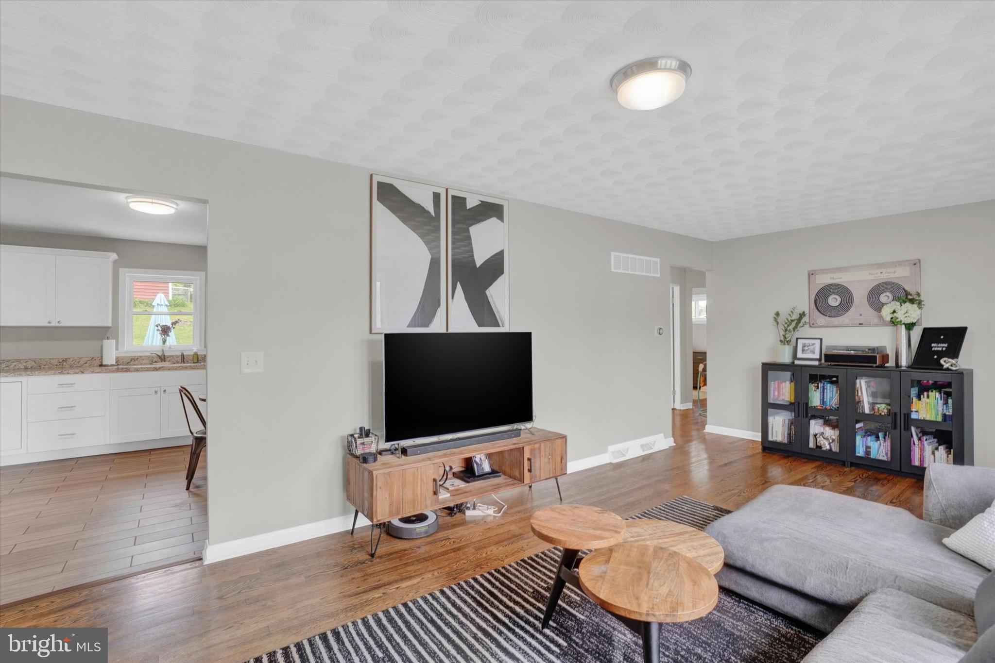 2560 Log Cabin Road York, PA 17408 - Photo 7 of 26 a living room with furniture and a flat screen tv