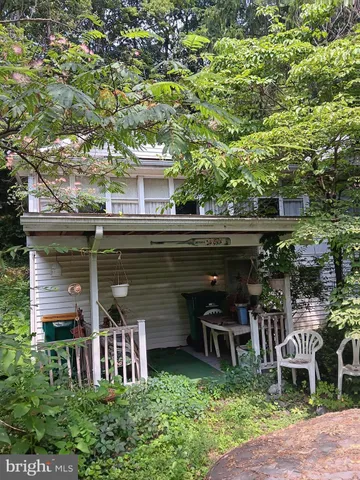 a view of a chairs and table in a patio