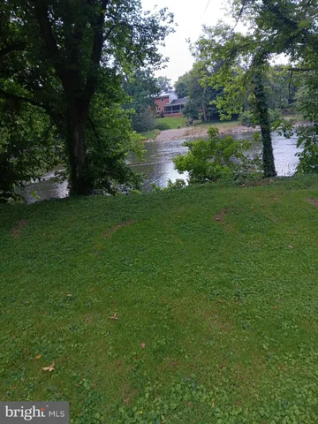a view of a lake with a yard