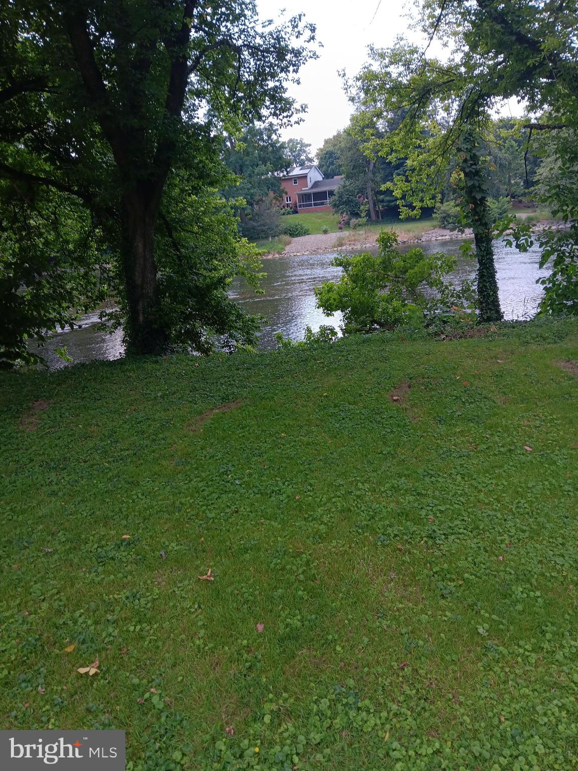 1000 Mill Road Mechanicsburg, PA 17050 - Photo 2 of 8 a view of a lake with a yard
