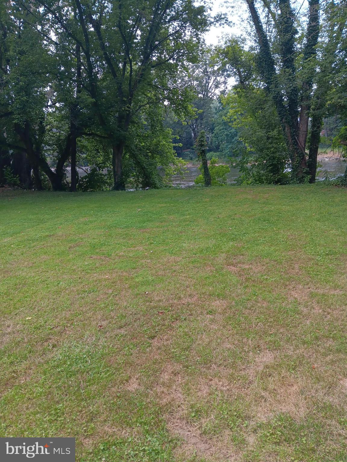 1000 Mill Road Mechanicsburg, PA 17050 - Photo 4 of 8 a view of a field with trees in the background