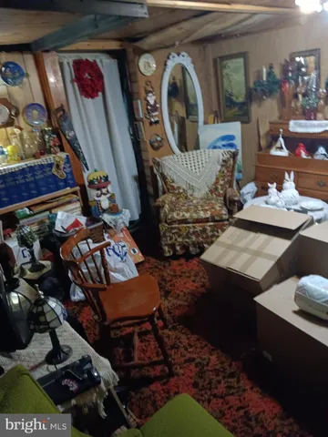 a view of living room with furniture and rug