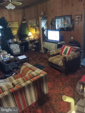 a bedroom with furniture and a lamp