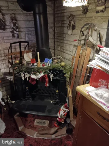 a room with water heater and wooden walls