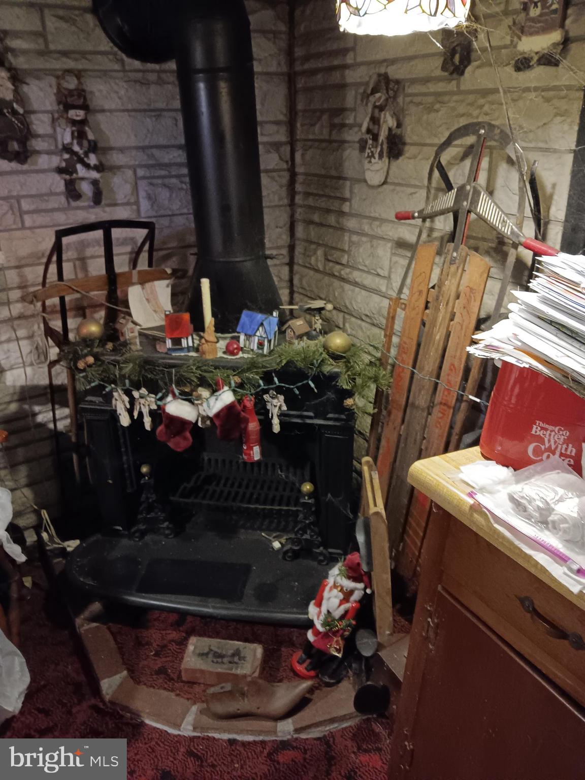 1000 Mill Road Mechanicsburg, PA 17050 - Photo 8 of 8 a room with water heater and wooden walls