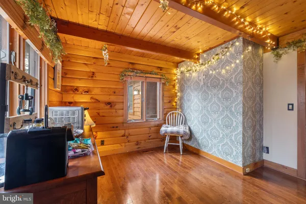 a balcony with table and chairs