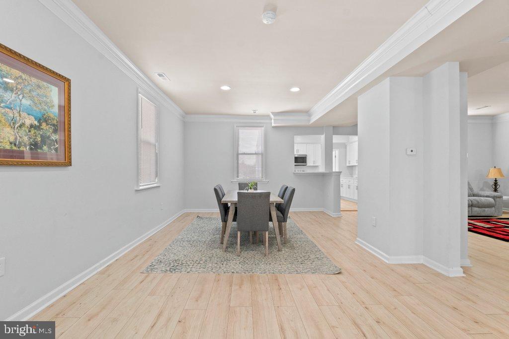 4919 Harford Road Baltimore, MD 21214 - Photo 22 of 48 a view of a dining room with furniture and wooden floor