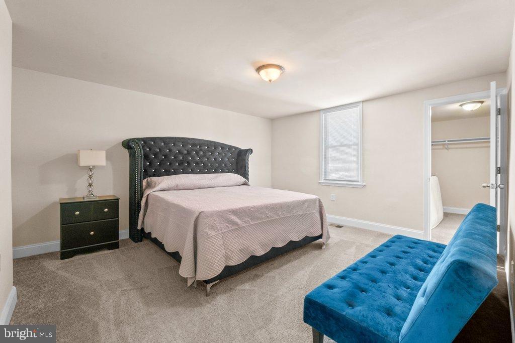 4919 Harford Road Baltimore, MD 21214 - Photo 29 of 48 a bedroom with a bed and window