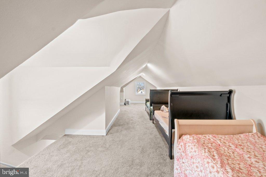 4919 Harford Road Baltimore, MD 21214 - Photo 38 of 48 a bedroom with a bed and a couch