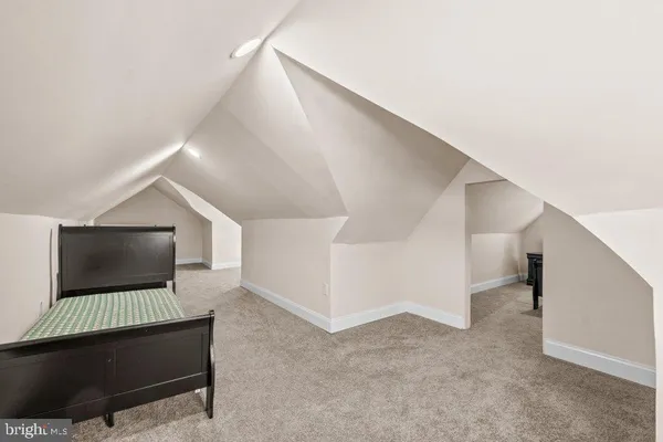 a living room with furniture and entryway