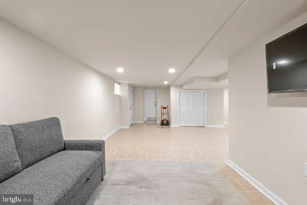 a view of a hallway with a chair and a table