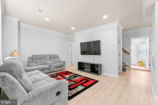 a living room with furniture and a rug