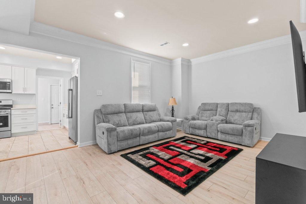 4919 Harford Road Baltimore, MD 21214 - Photo 9 of 48 a living room with furniture and a rug