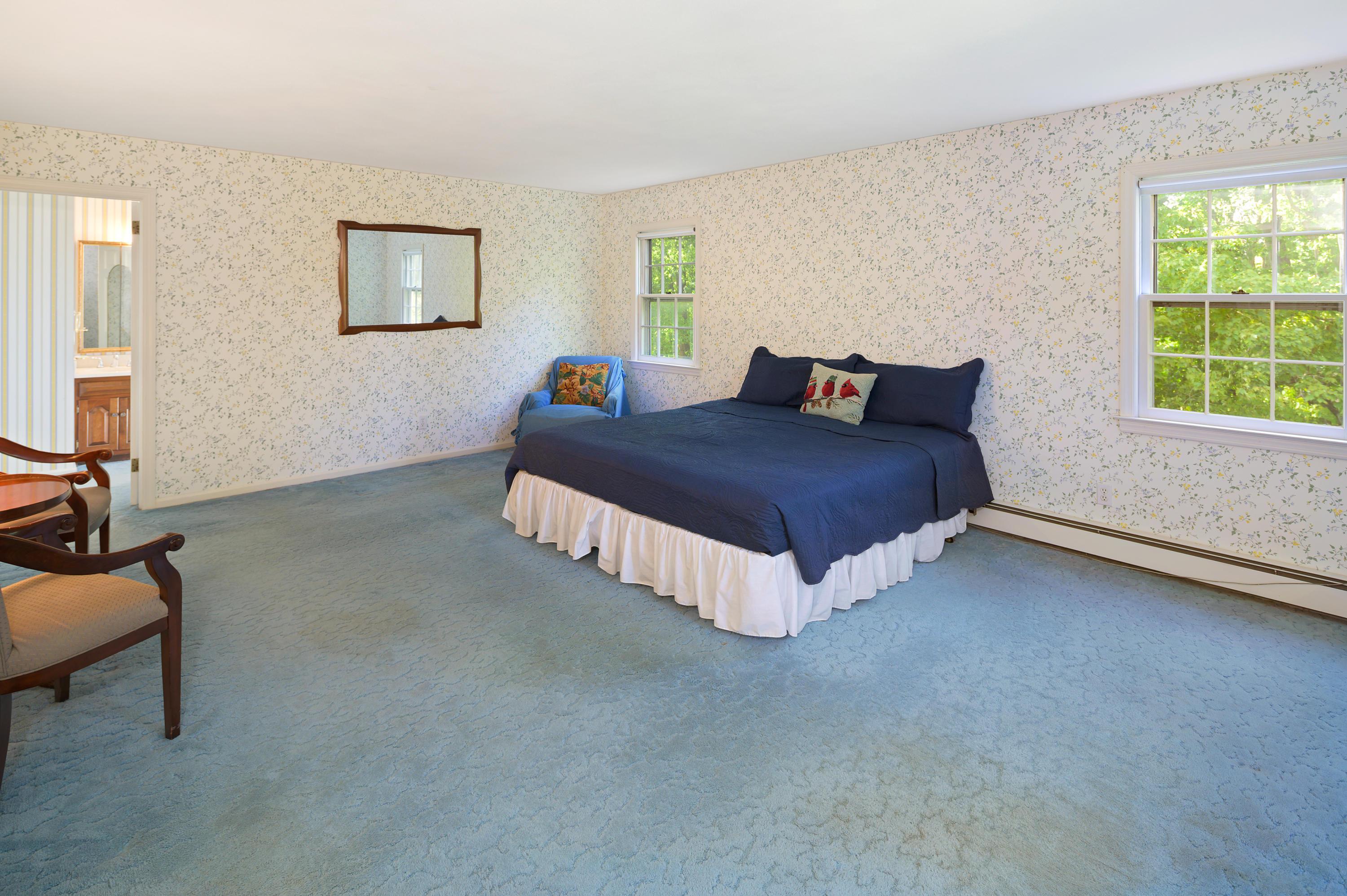 12 Lynam Road Stamford, CT 06903 - Photo 11 of 21 a spacious bedroom with a bed and a couch
