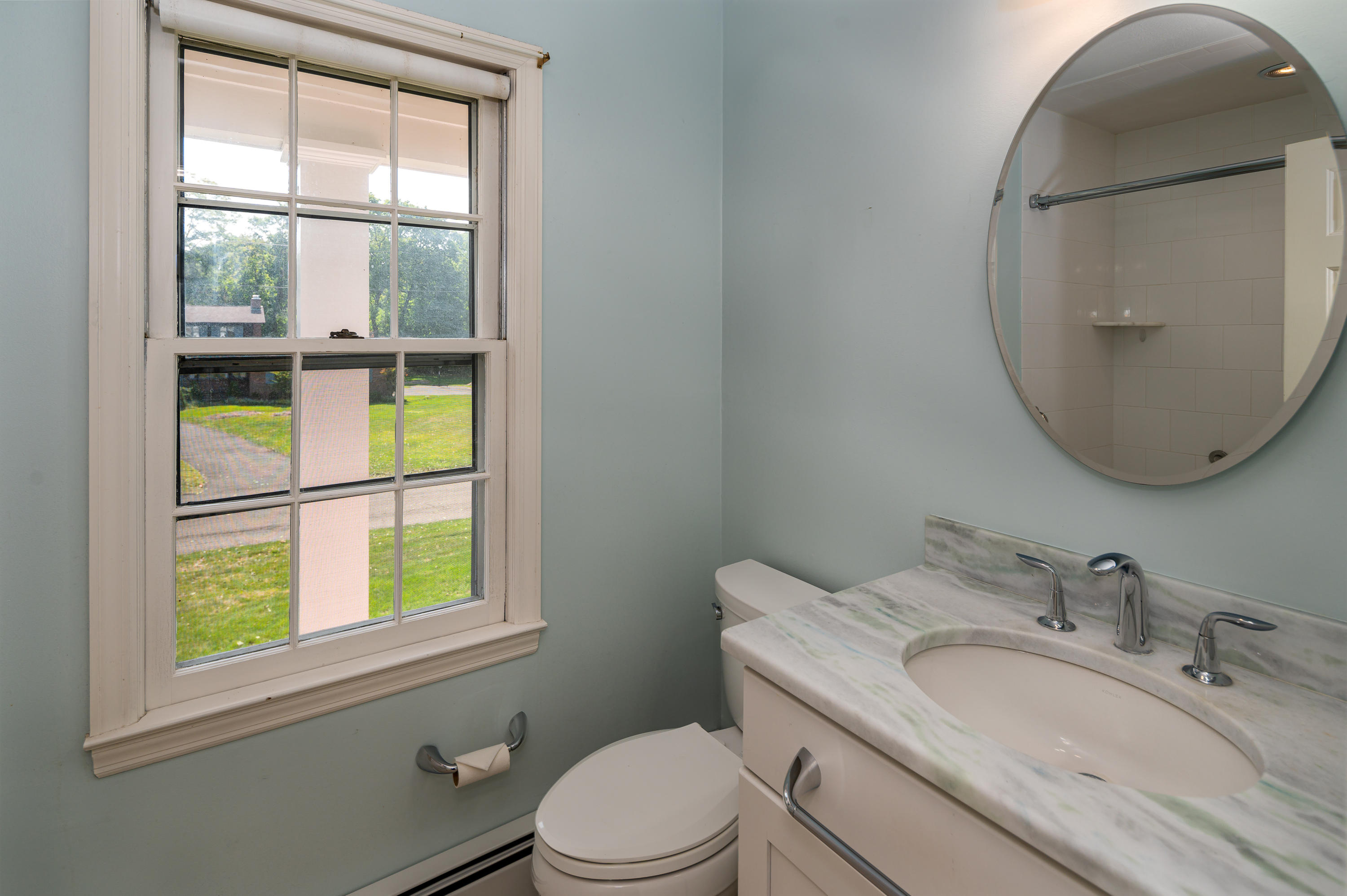 12 Lynam Road Stamford, CT 06903 - Photo 13 of 21 a bathroom with a granite countertop toilet a sink and a mirror