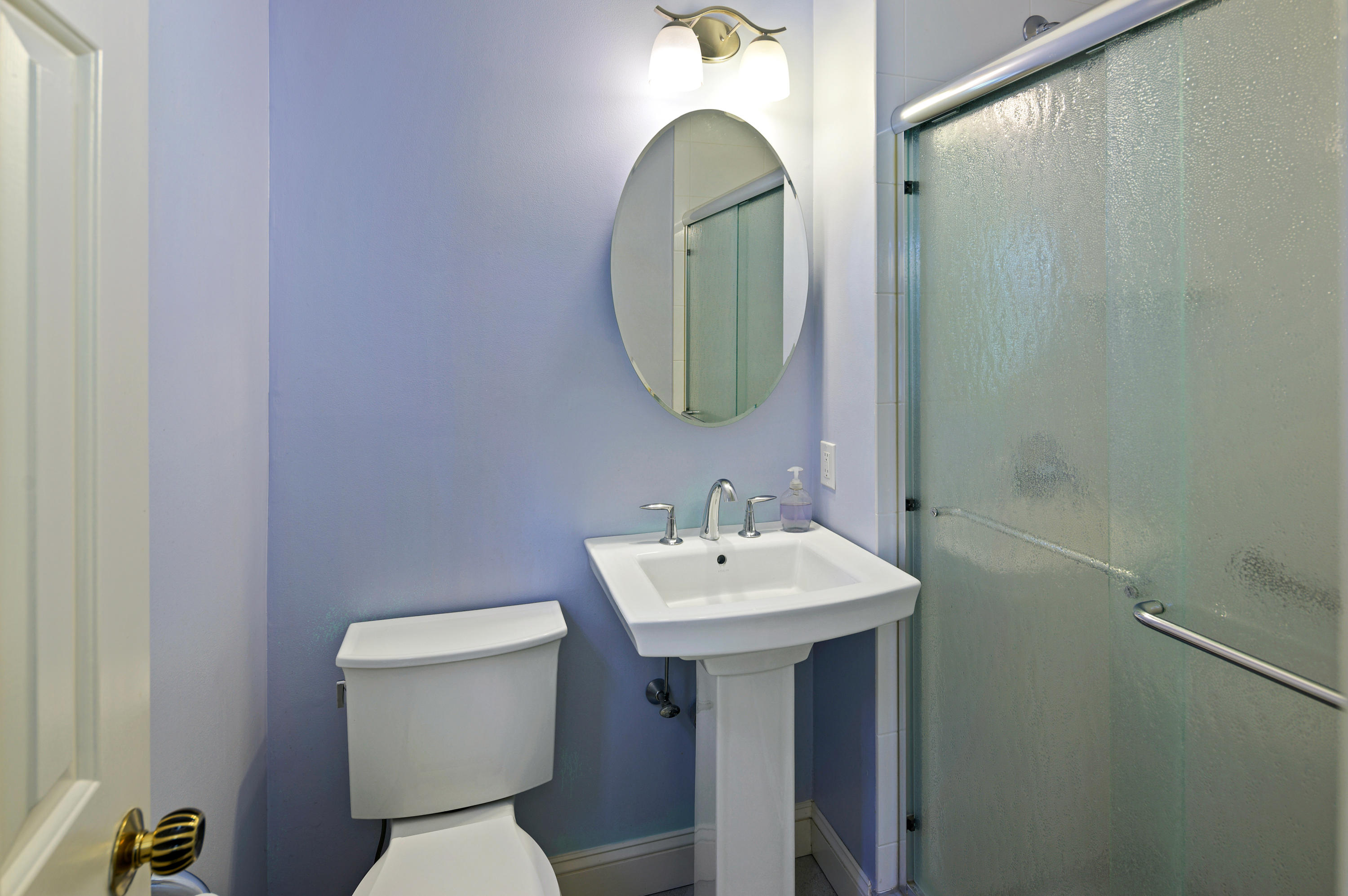 12 Lynam Road Stamford, CT 06903 - Photo 14 of 21 a bathroom with a sink mirror and toilet
