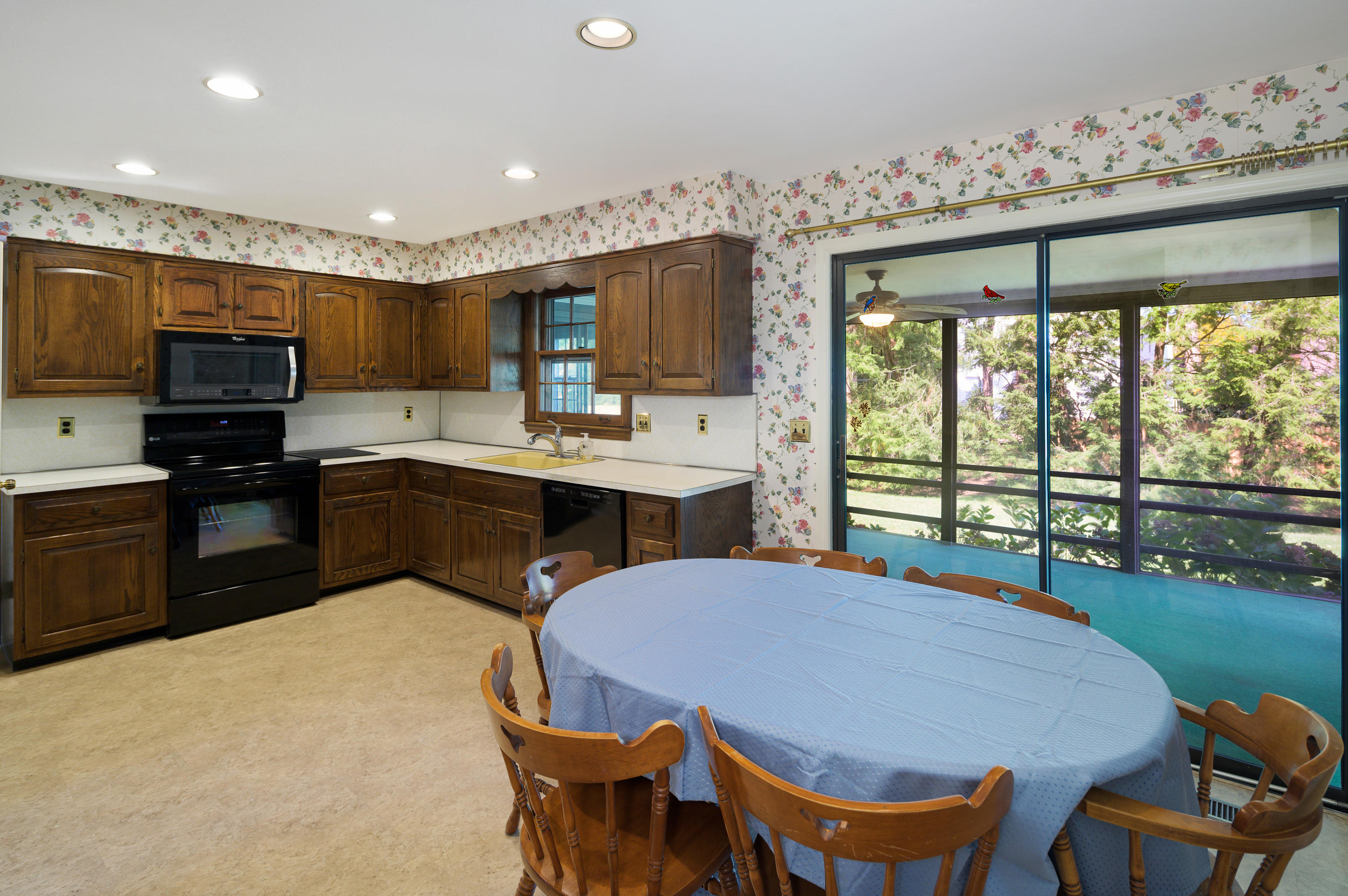 12 Lynam Road Stamford, CT 06903 - Photo 7 of 21 a kitchen with a table chairs sink and cabinets